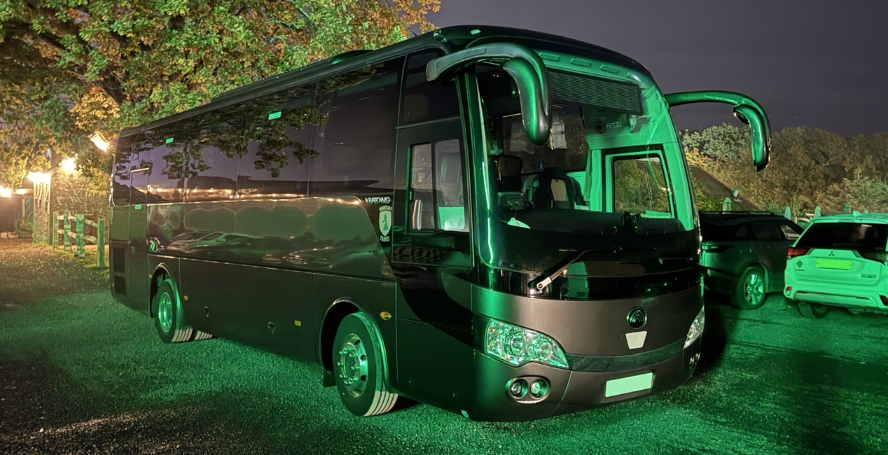 Luxury Coach at night with lights on
