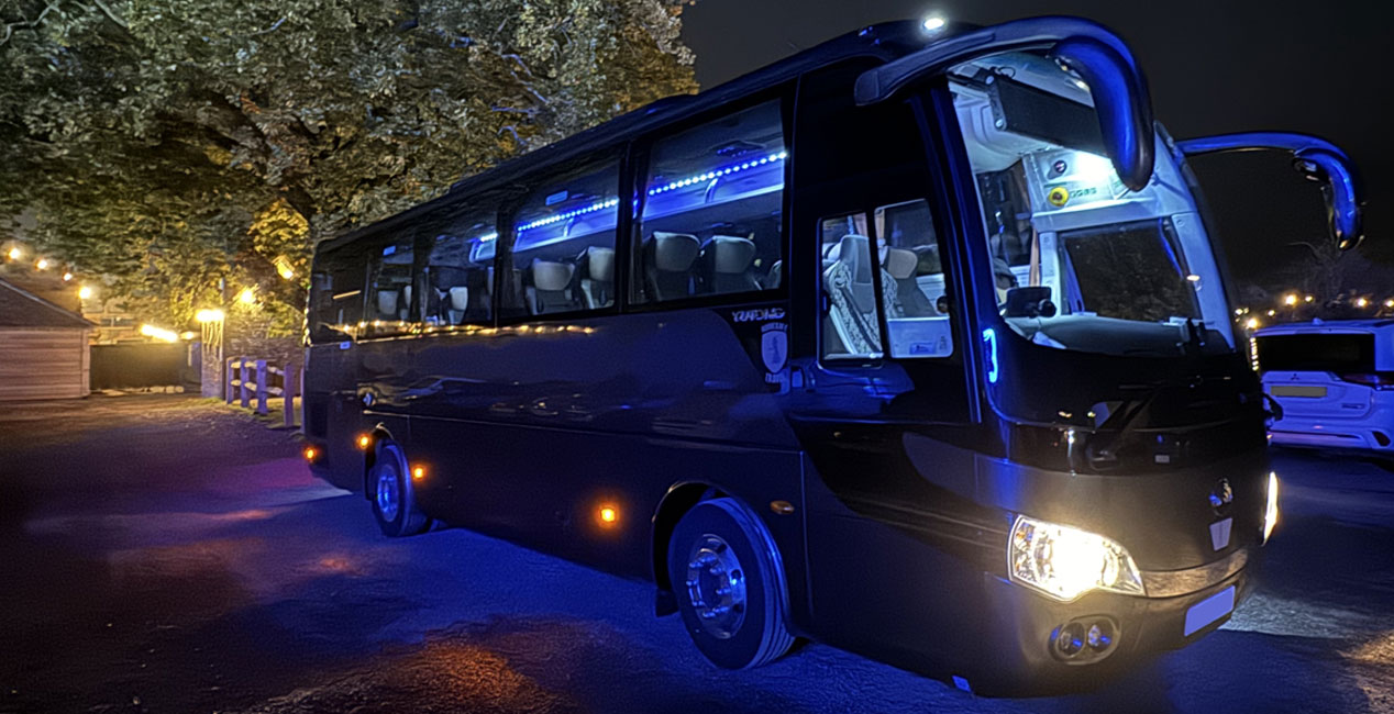 Luxury Coach at night with lights on